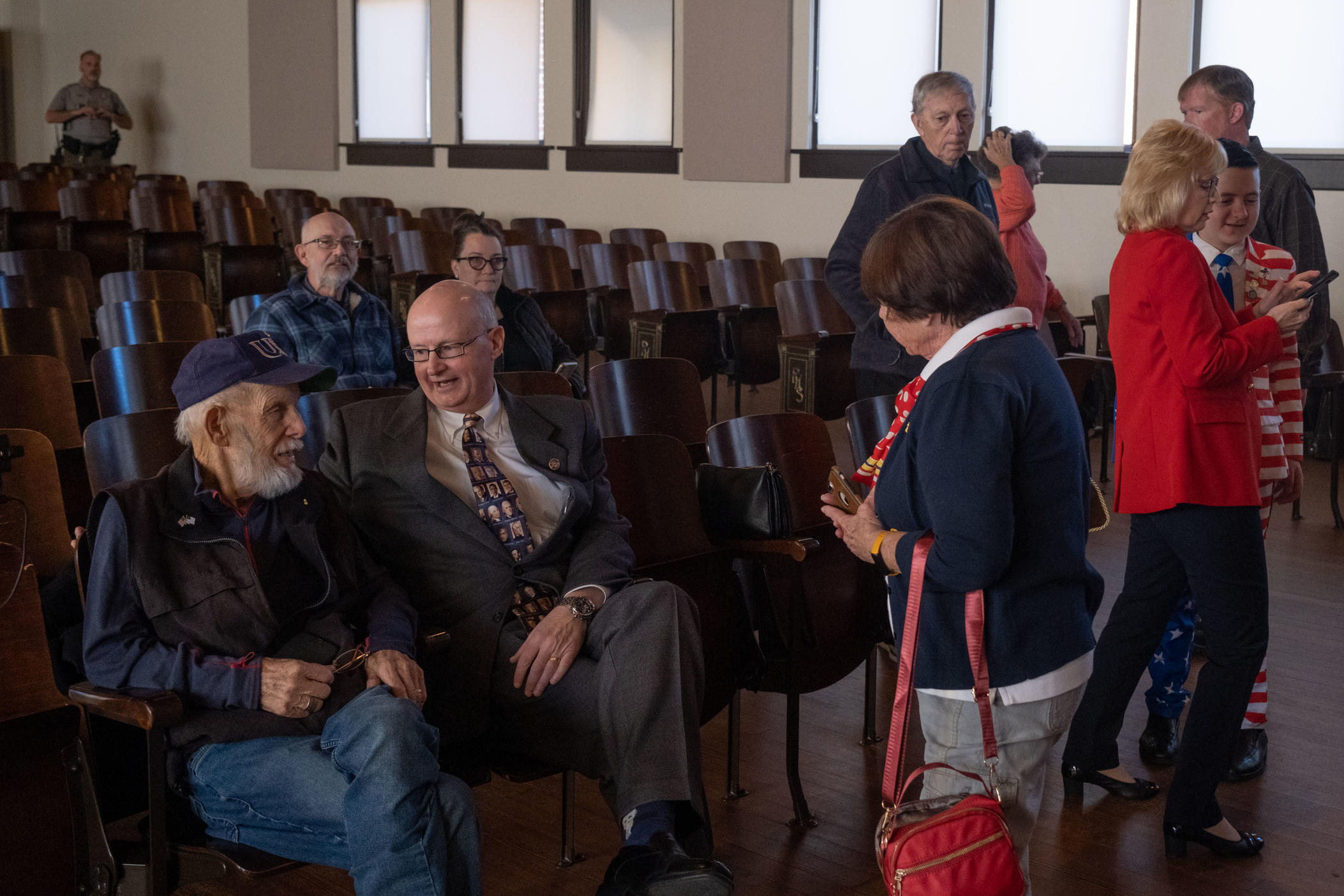 Presidential historian Larry Cook sits with graduate from Plains High School, George Williams, in the school's former auditorium on Feb. 19, 2024. Cook has been giving talks at the Jimmy Carter National Historic Park for 13 years.