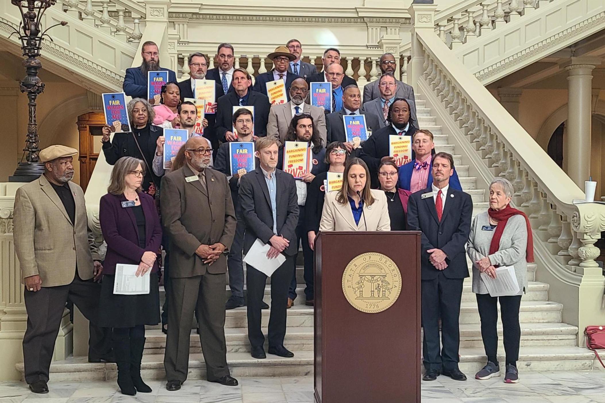 Members of the United Campus Workers of Georgia gathered at the state capitol on Jan 30, 2024 to demand better pay and more funding across the university system.