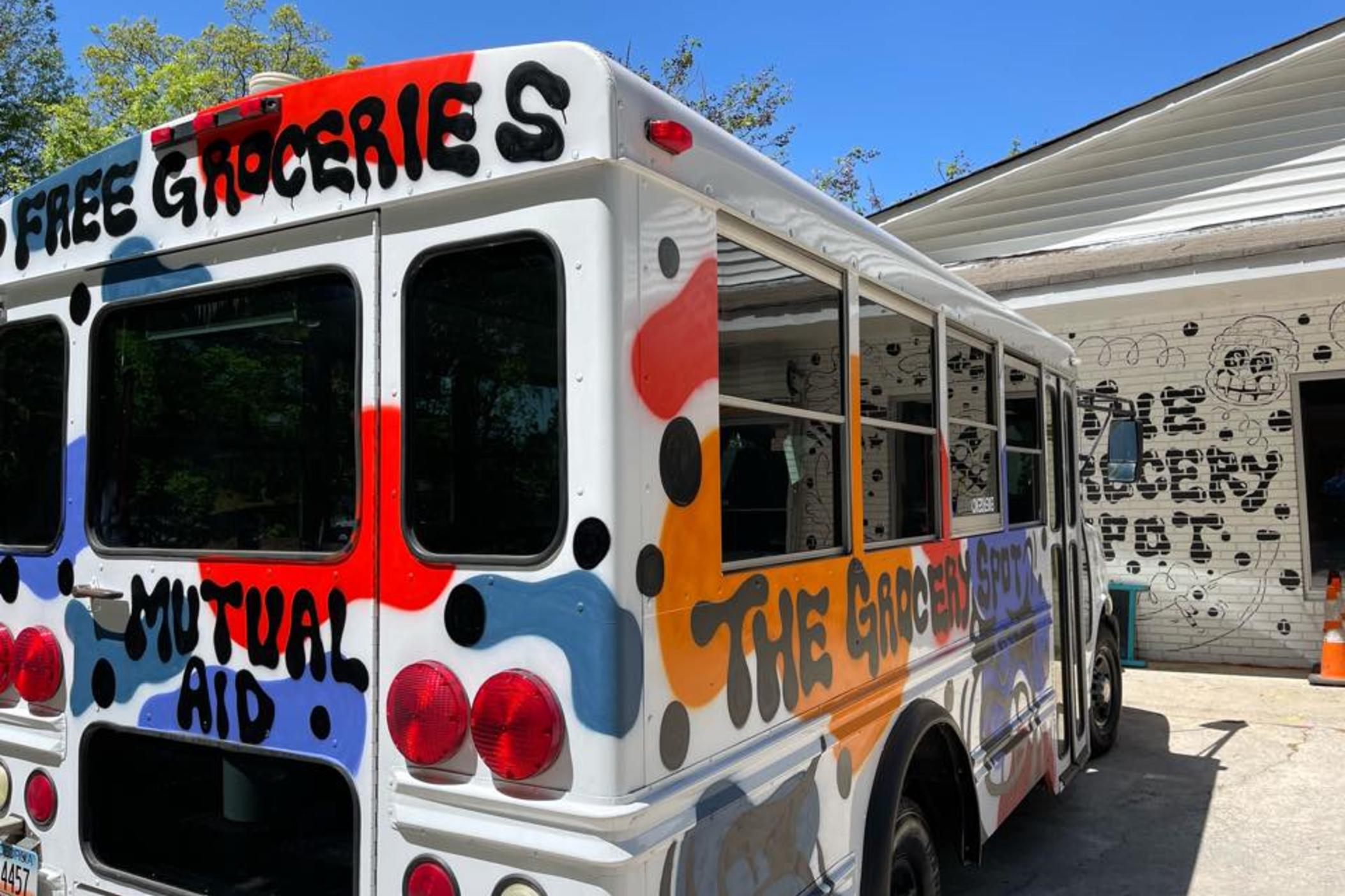 The Grocery Spot is written in Black spray paint on the side of a white bus. Mutual aid is written on the back. has been offering free groceries from their Atlanta store since 2021. Now they're asking for more donations and volunteers to serve more people.