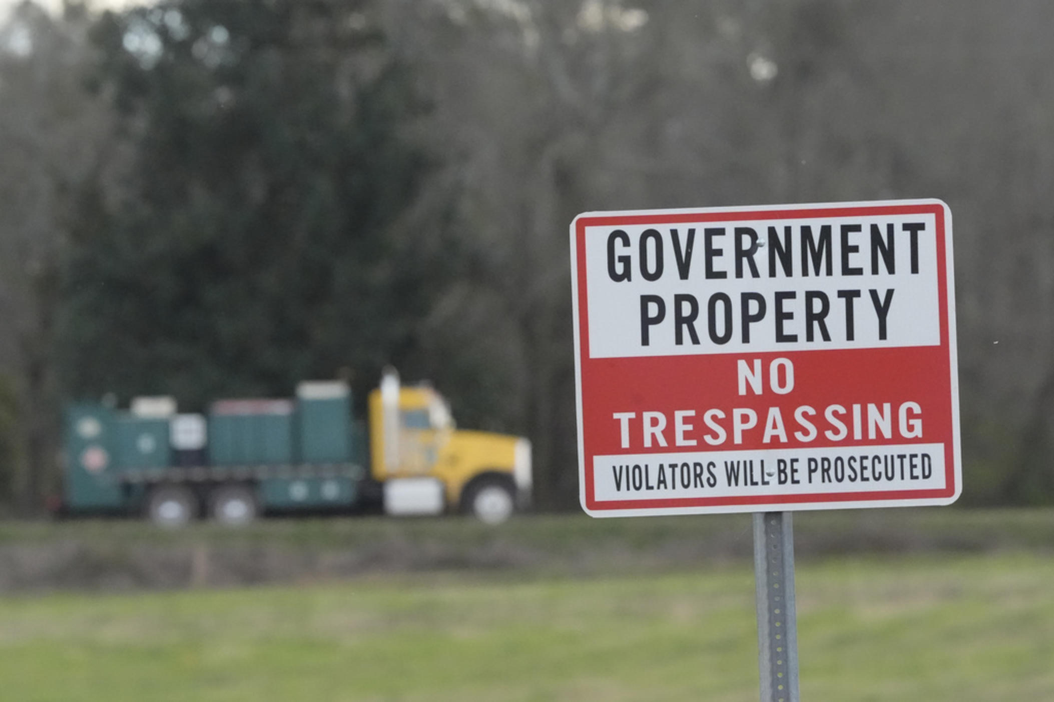 A truck leaves the site of a planned Rivian electric truck plant Thursday, March 7, 2024, in Rutledge,Ga. Rivian says it's pausing construction of the $5 billion manufacturing plant in Georgia.