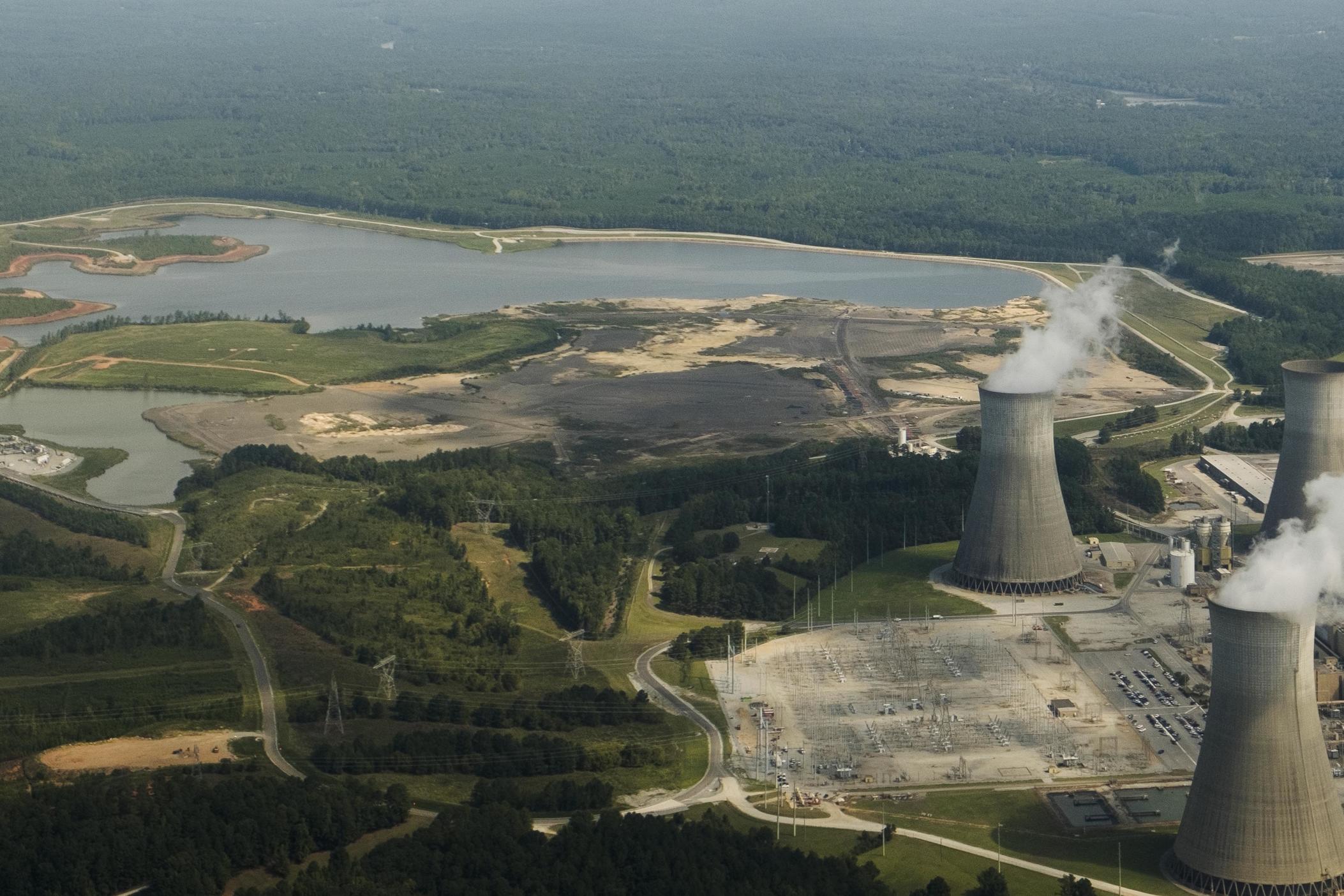 Georgia Power's Plant Scherer, right, and its Ash Pond 1, upper left, in September of 2023. 