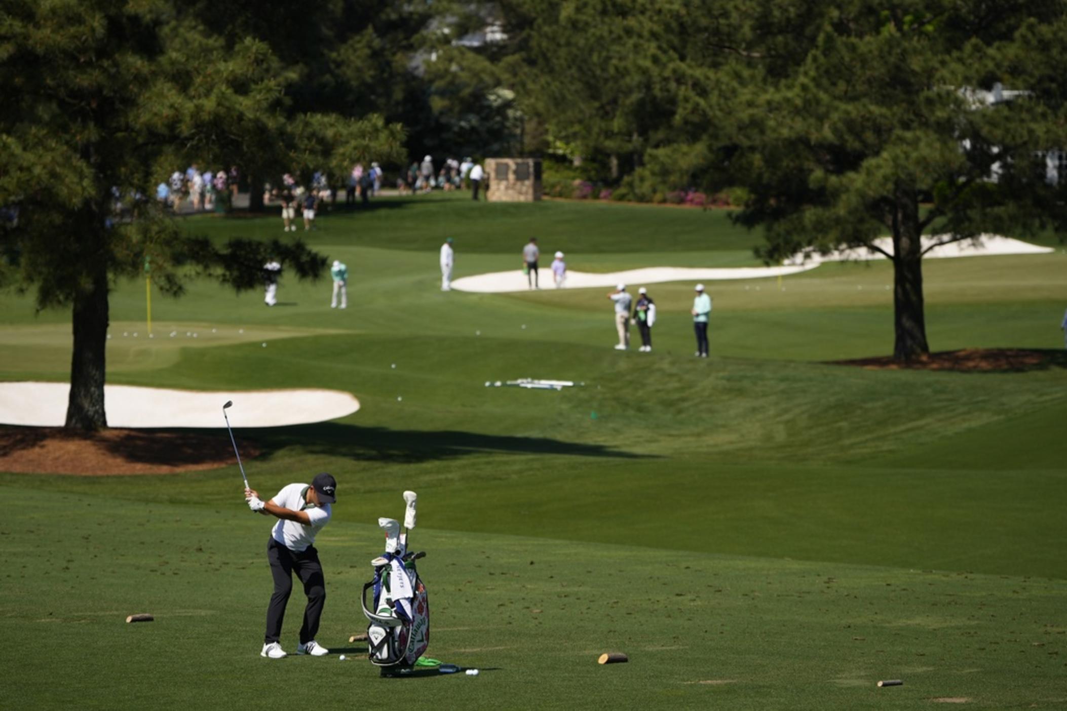 Xander Schauffele hits on the practice range during a practice round in preparation for the Masters golf tournament at Augusta National Golf Club Monday, April 8, 2024, in Augusta, Ga. 