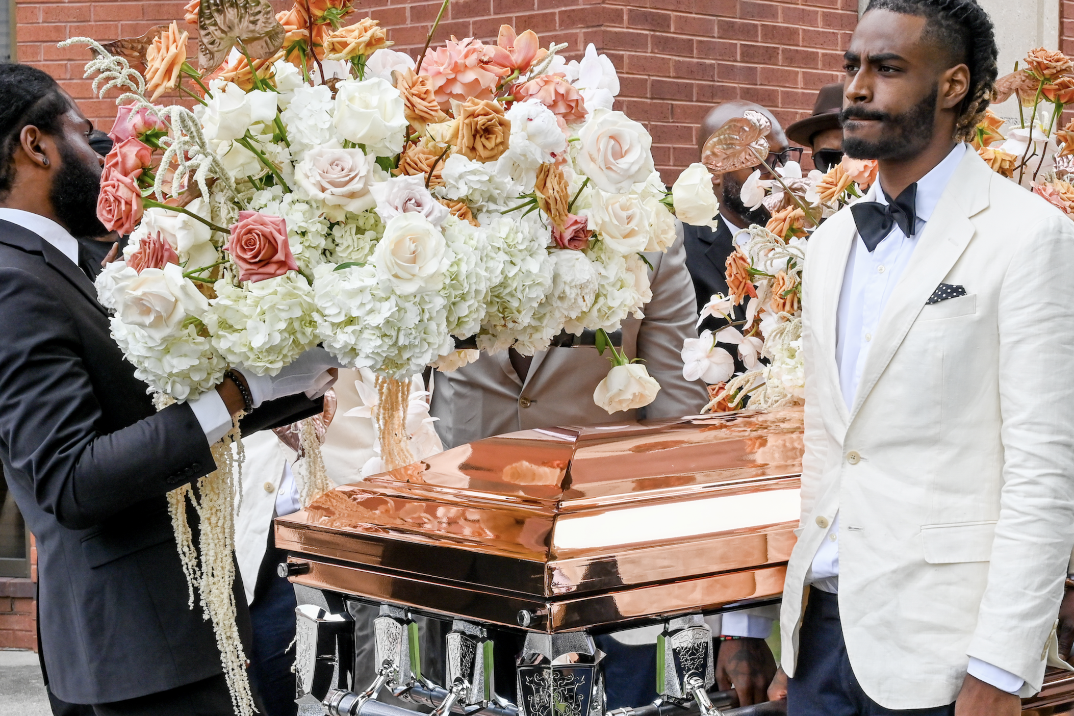 Rico Wade II serves as lead pallbearer at the "celebration of life" for his father Rico Renard Wade, a charismatic architect of Atlanta's contemporary music scene.