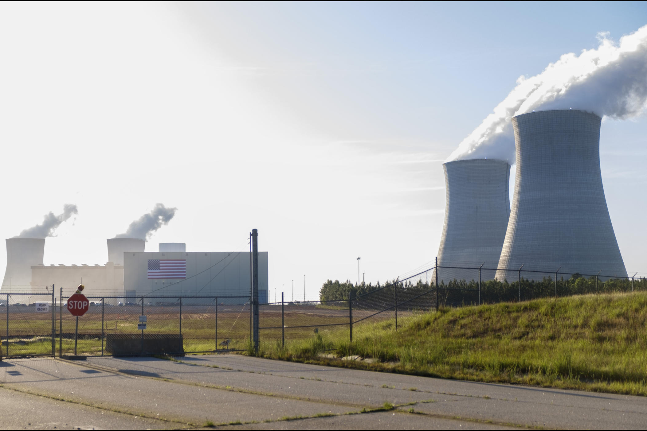 The cooling towers of Plant Vogtle Units 3 and 4, left, and the decades older 1 and 2, right. The new units are Westinghouse AP1000s, the first and second of their kind, respectively, in the world. 