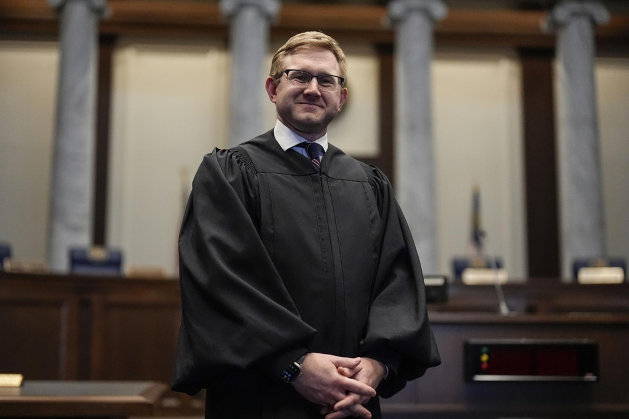 Supreme Court Justice Andrew Pinson poses for a photo, Wednesday, April 17, 2024, in Atlanta. Ga. Republican Gov. Brian Kemp announced Tuesday, May 14, 2024 that his political committee would spend $500,000 to support Pinson in his nonpartisan election race against John Barrow in a nonpartisan election for Supreme Court Justice, in May. 