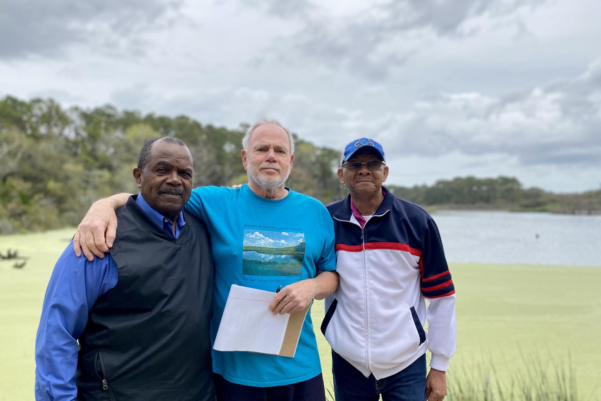 Harris Neck Land Trust chairman Winston Relaford, executive director Dave Kelly and board member Wilson Moran pose next to Woody Pond at Harris Neck National Wildlife Refuge in McIntosh County, Georgia.