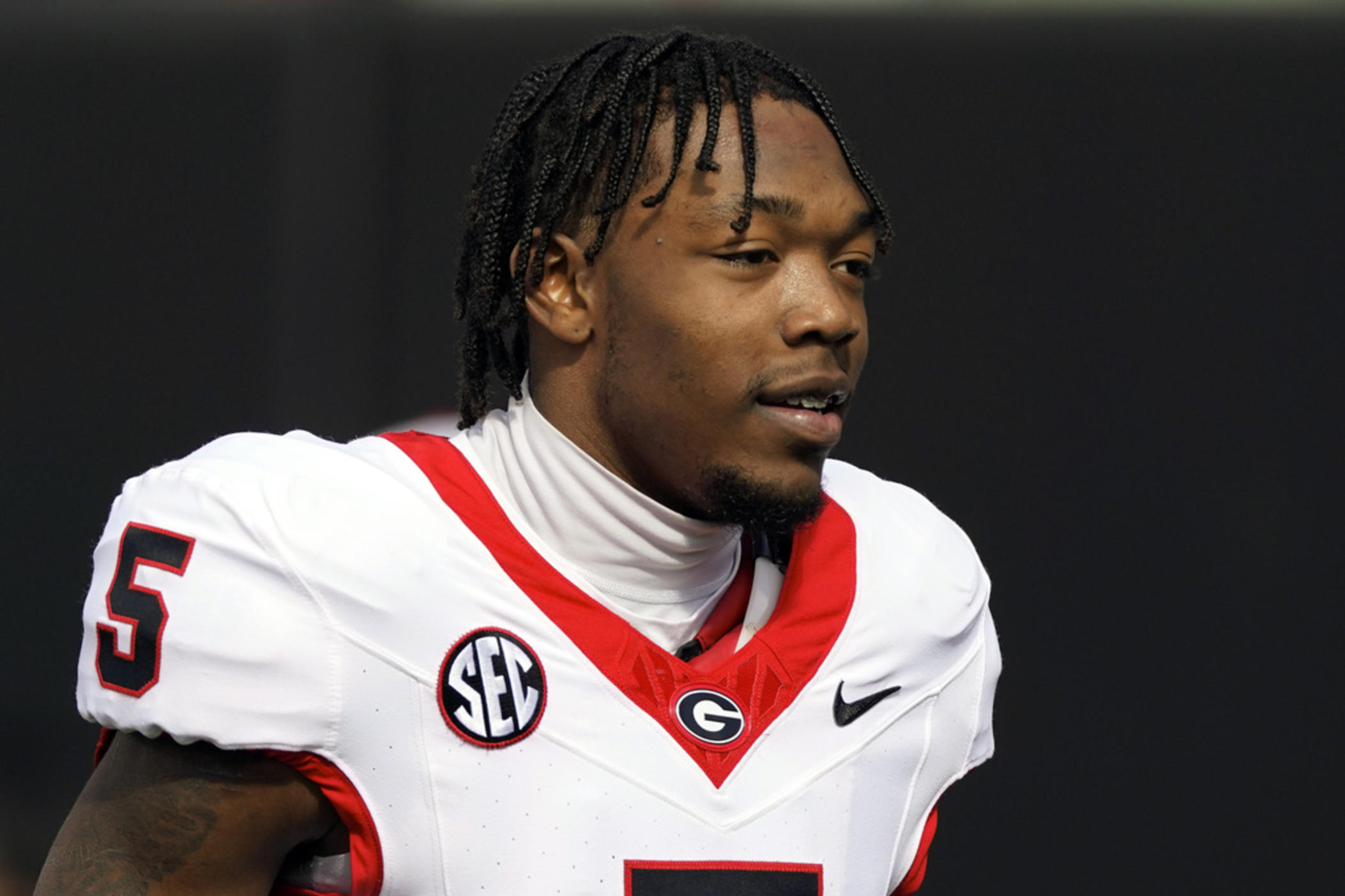 Georgia wide receiver Rara Thomas (5) warms up before an NCAA college football game against Vanderbilt, Saturday, Oct. 14, 2023, in Nashville, Tenn. Thomas was arrested on charges of cruelty to children and battery early Friday, July 26, 2024, in Athens, Ga., adding to the team's recent legal woes.