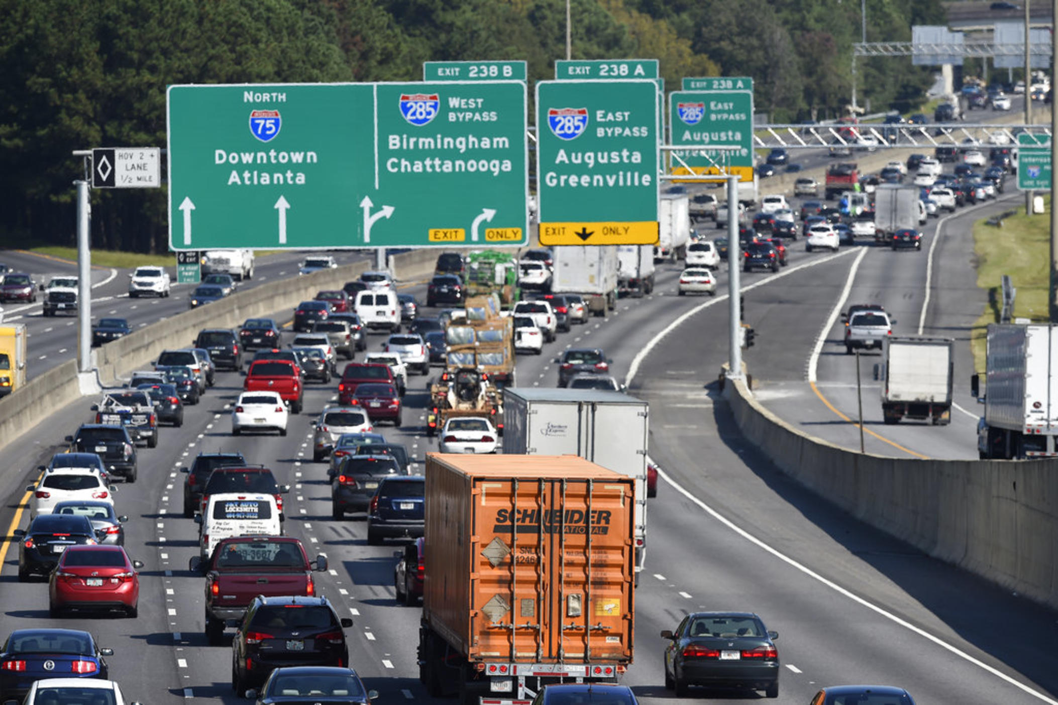 Heavy traffic on Interstate 75 moves slowly, Friday, Sept. 8, 2017, in Forrest Park, South of Atlanta.