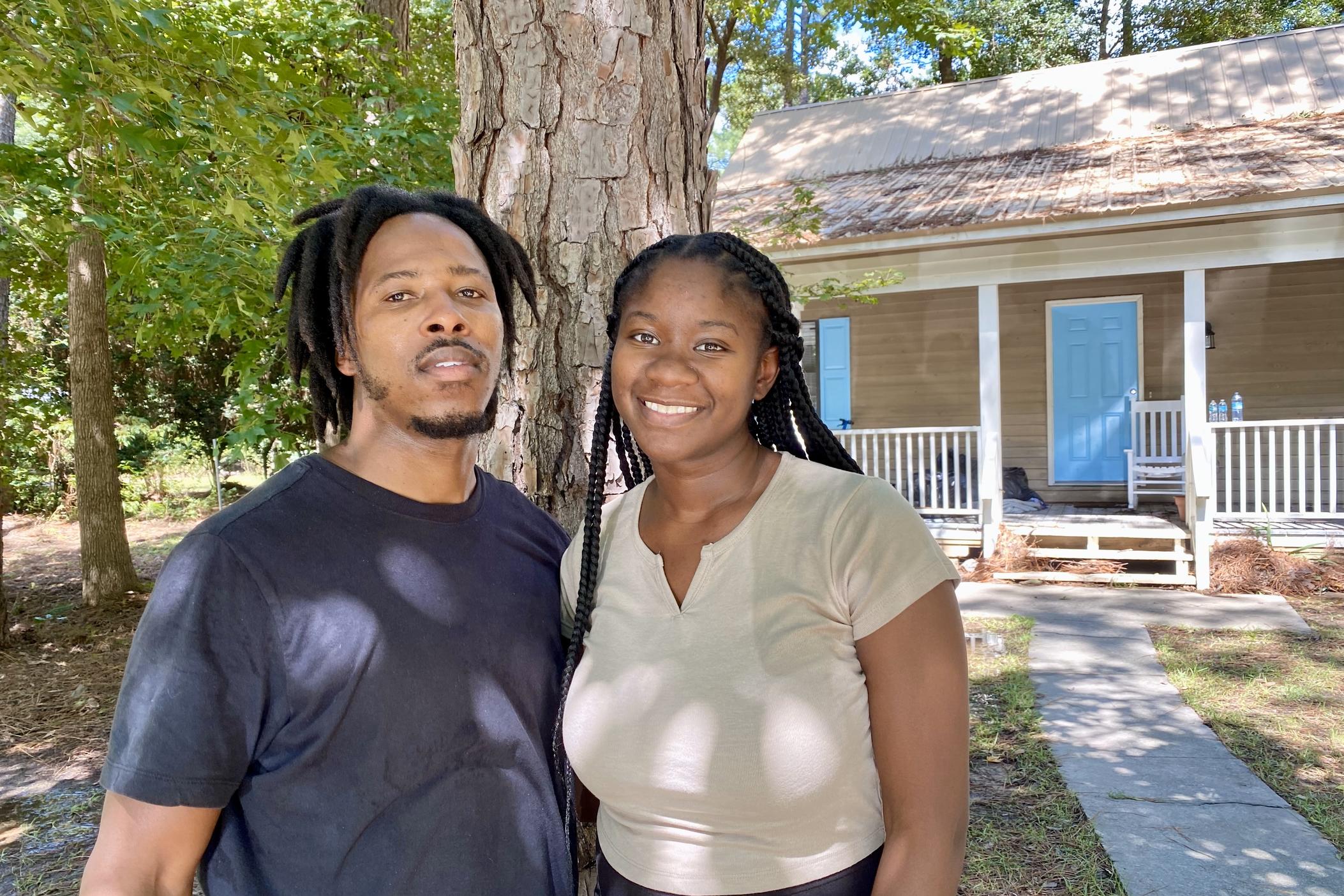 Arsenio and Allie Wright stand in front of their house in the Mill Creek Landing neighborhood east of Statesboro in Bulloch County on Thursday, Aug. 8, 2024.