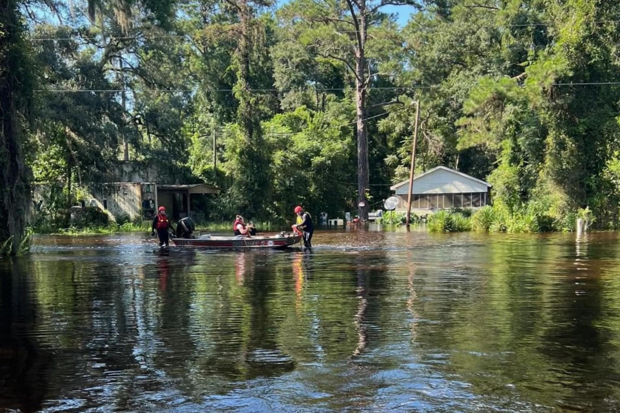 Bryan County resident Christy Mingledorff and her two children had to evacuate their house, seen at right, in the Morgan's Bridge neighborhood after it flooded on Thursday, Aug. 8, 2024.