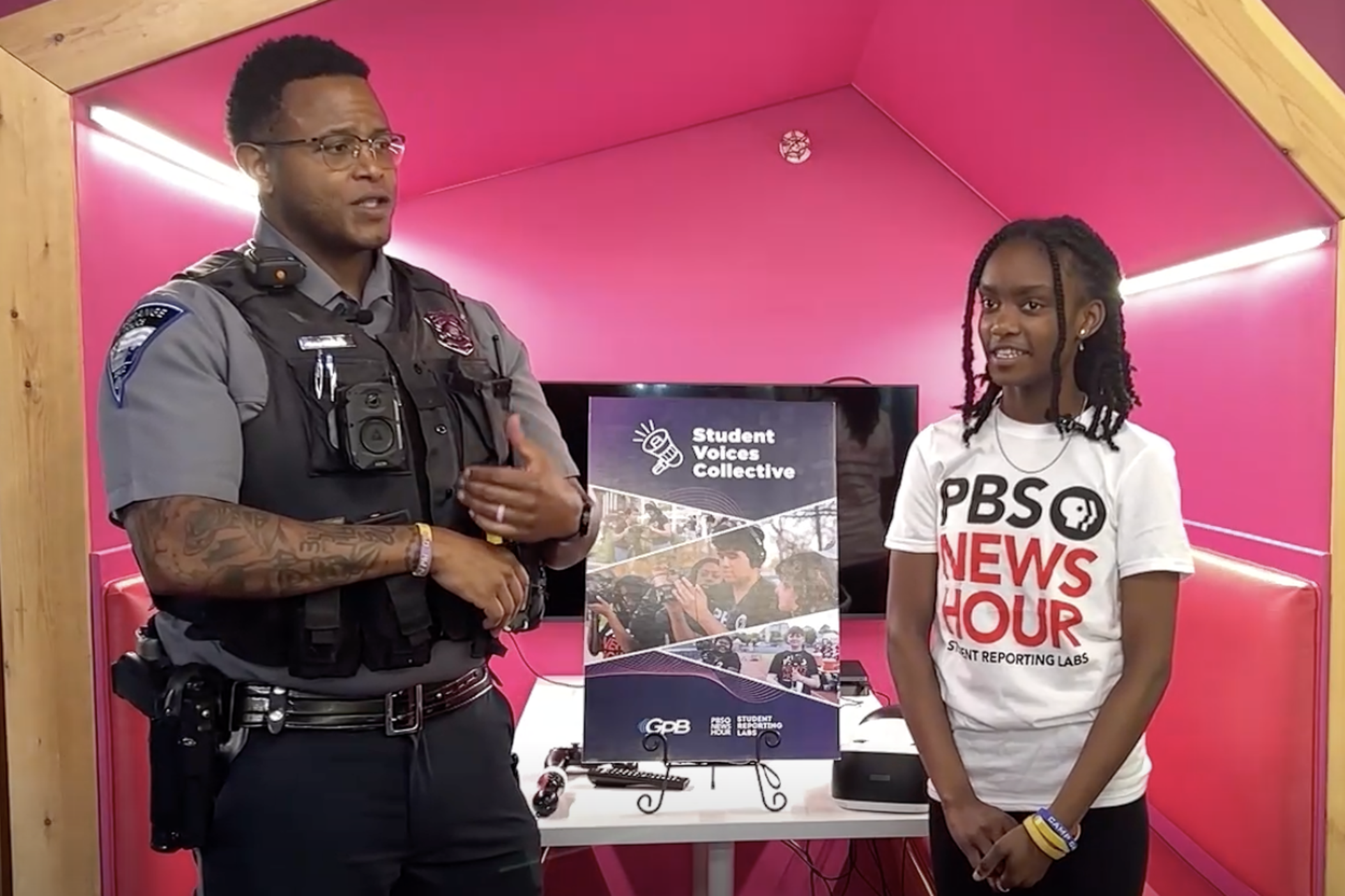 Alexandria Dowell (right) interviews LaGrange police officer Bryan Mosley (left) about democracy in September 2024.