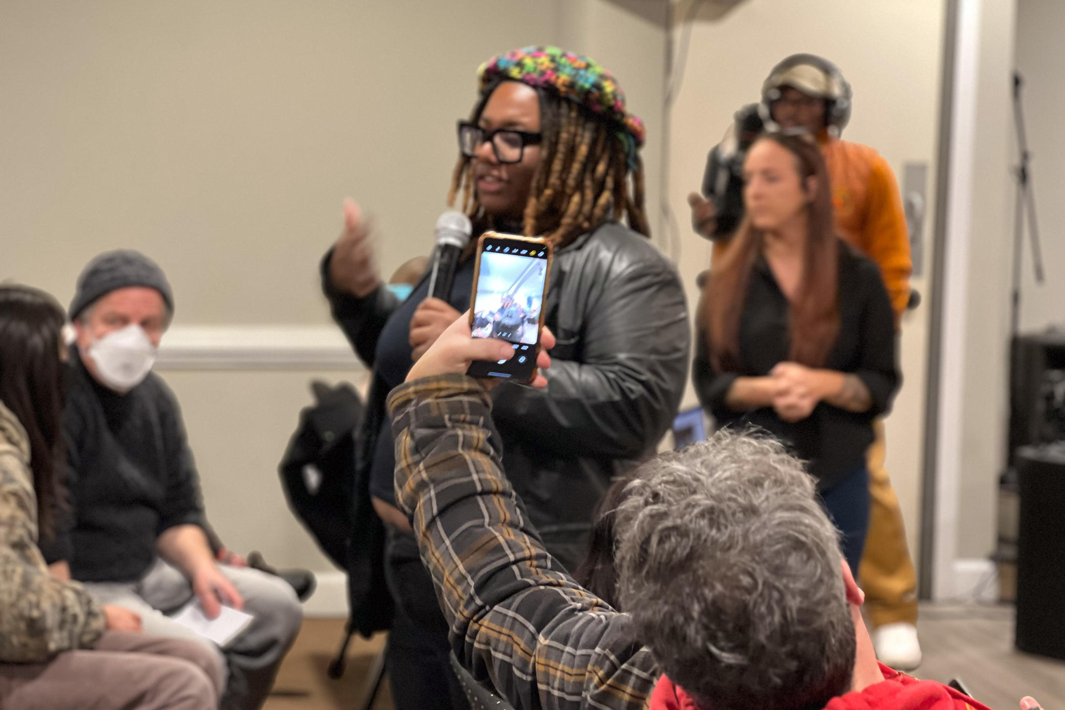 Monica Johnson, member of the Shutdown BioLab Coalition, speaks at a Dec 3. community forum in Conyers