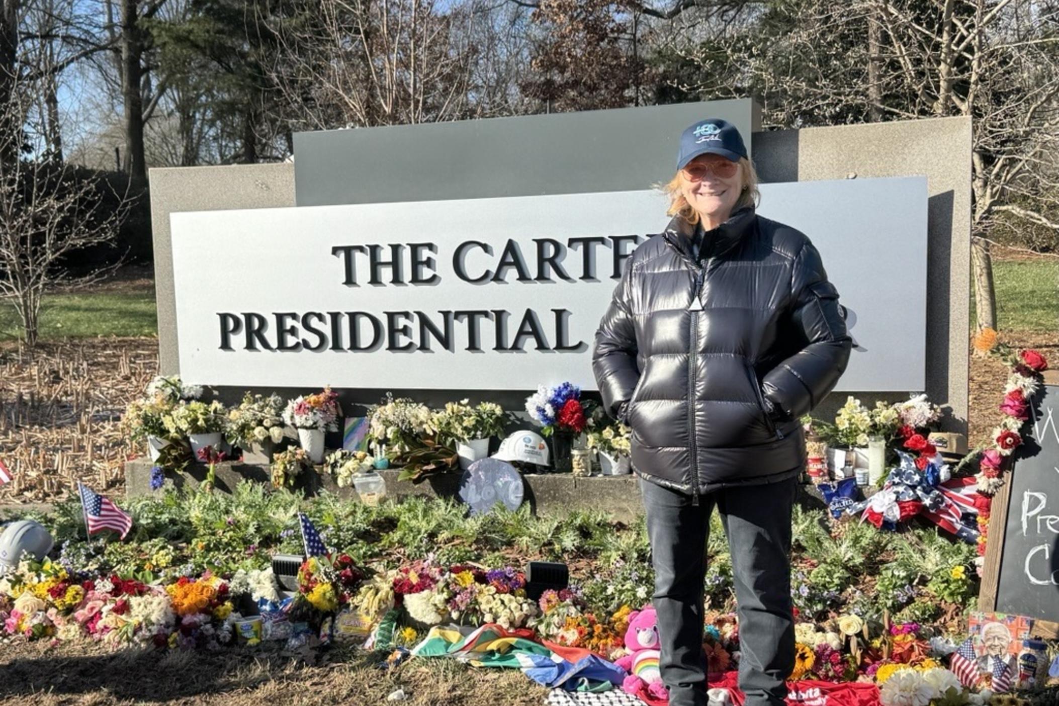 Emily Saliers visits the flower memorial at the Carter Center to pay her respects to former President Jimmy Carter on Jan. 8, 2025. Carter died on Dec. 29, 2024 at age 100.