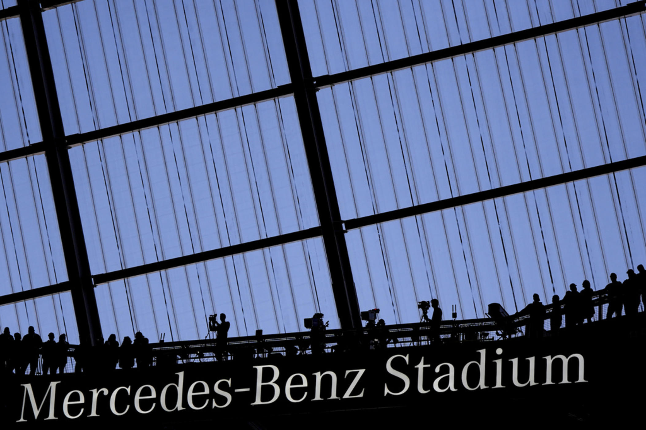 Fans watch an NFL football game at the Mercedes-Benz Stadium in Atlanta, Dec. 1, 2024.