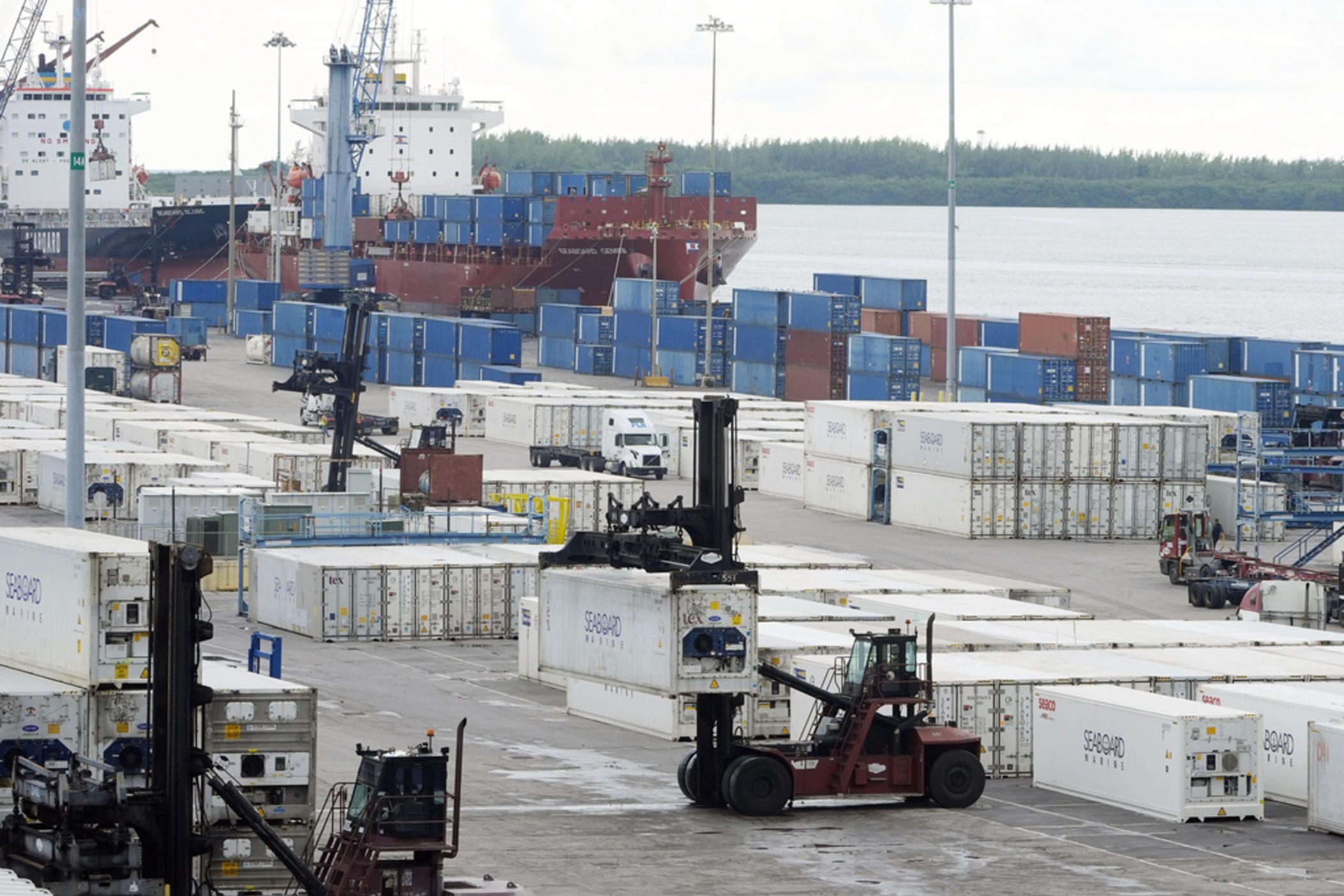 Dockworkers return to work at Port Miami, Oct. 4, 2024, in Miami, after the union representing 45,000 striking U.S. dockworkers at East and Gulf coast ports has reached a deal to suspend a three-day strike until Jan. 15 to provide time to negotiate a new contract. 
