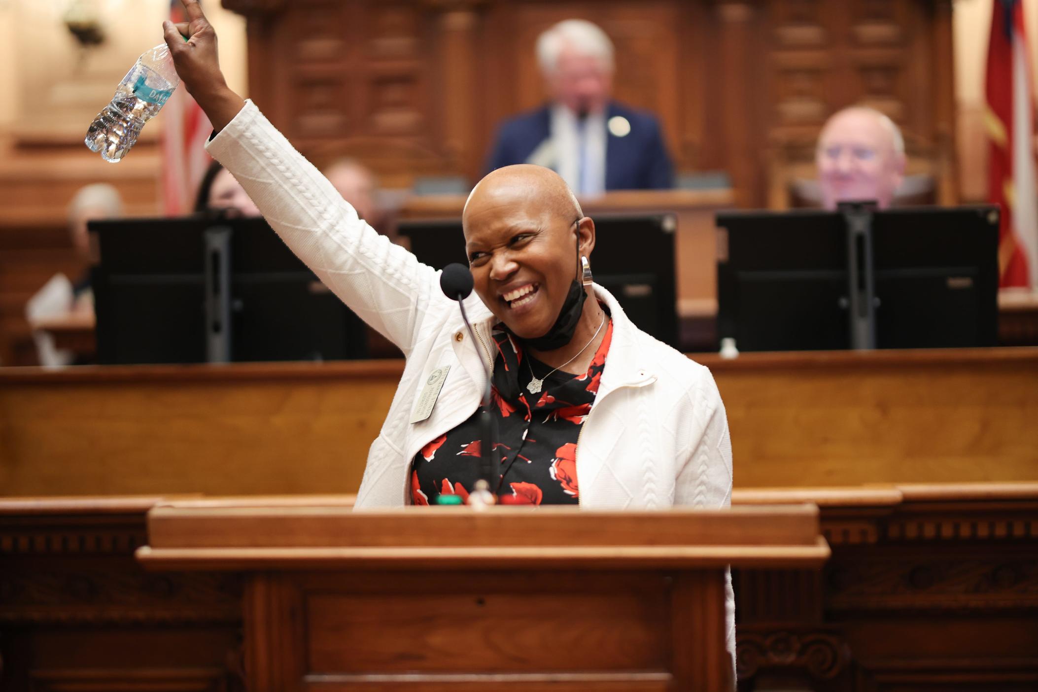 Georgia Representative Patty Stinson (D-Butler) celebrated on the House floor after sharing she had her last chemotherapy for breast cancer on Tuesday, March 11, 2025. Credit: Georgia House of Representatives 