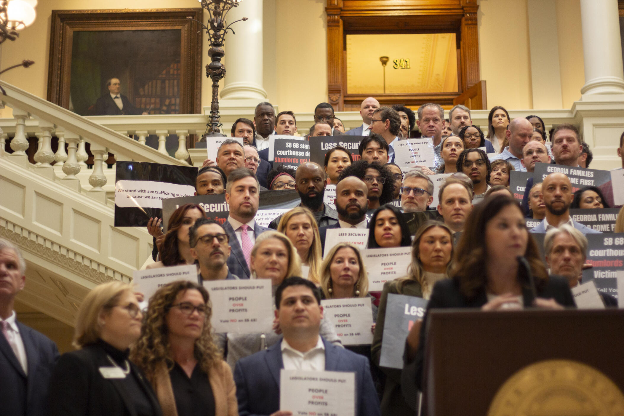 Advocates of survivors of sexual abuse and exploitation lined the South steps at the state Capitol on March 20, 2025 in opposition to SB 68, which some say would make it nearly impossible for victims of violent crimes to prove negligence in injury and wrongful death lawsuits. The bill passed narrowly in the House.