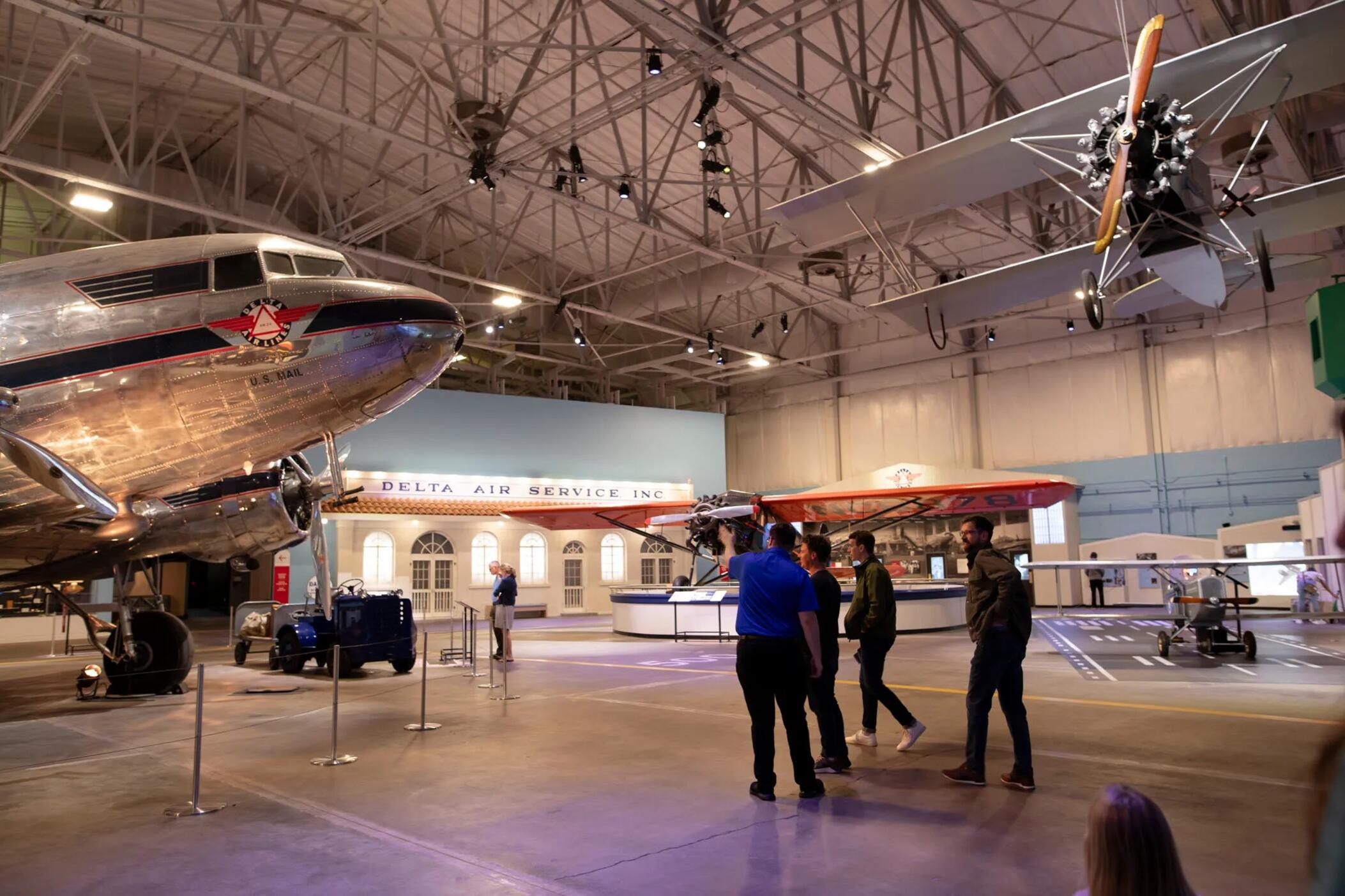 Visitors explore the Legacy Hangar of the Delta Flight Museum
