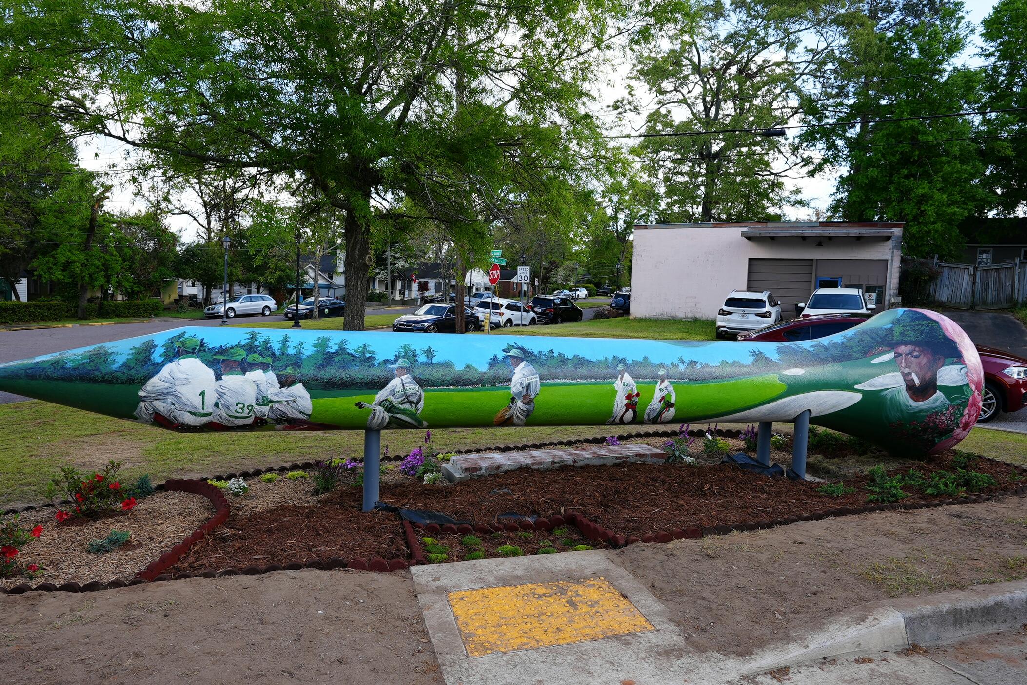 A mural depicting Augusta's Black caddies in Sand Hills.