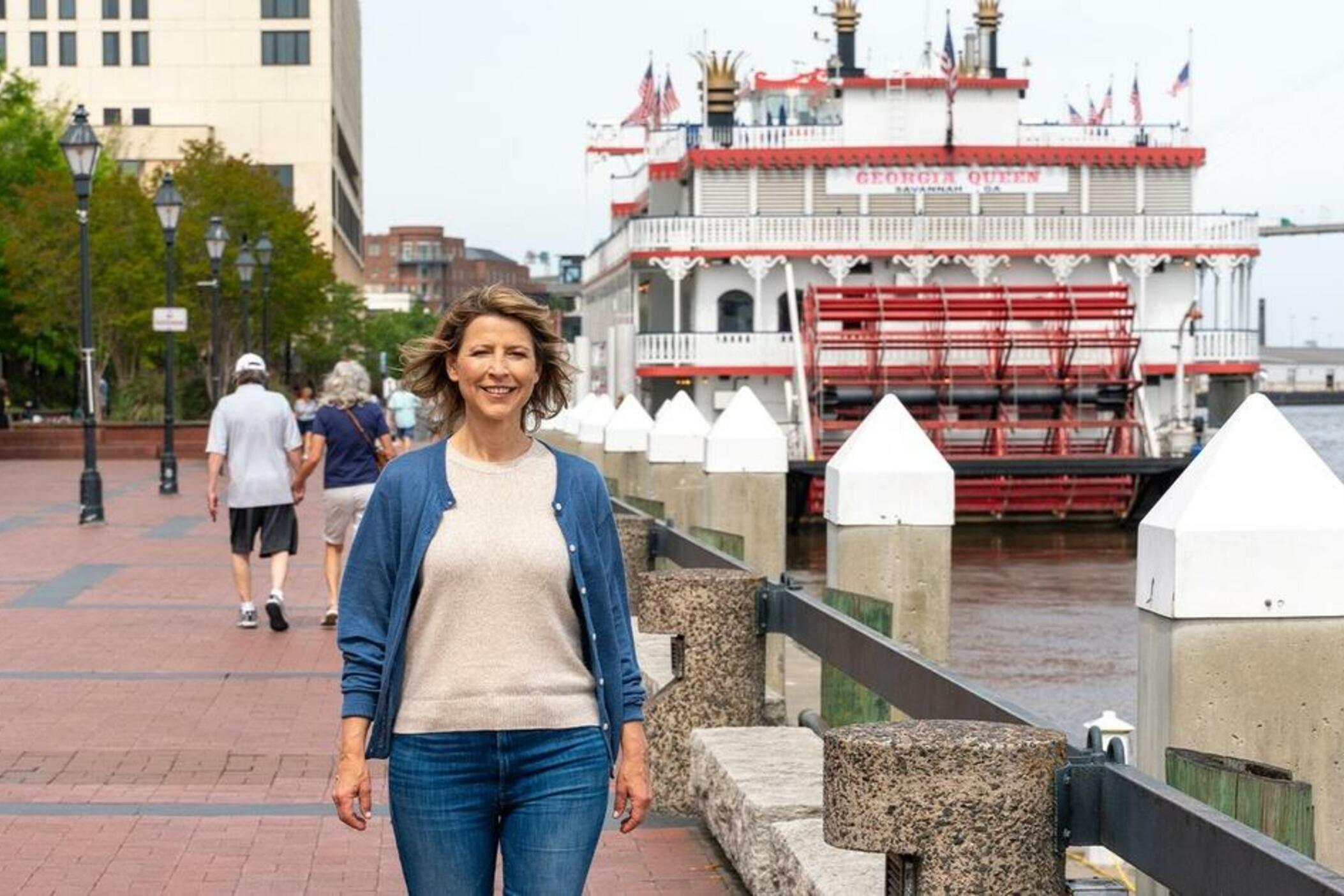 Host Samantha Brown walks by the Savannah riverfront in Savannah, Georgia