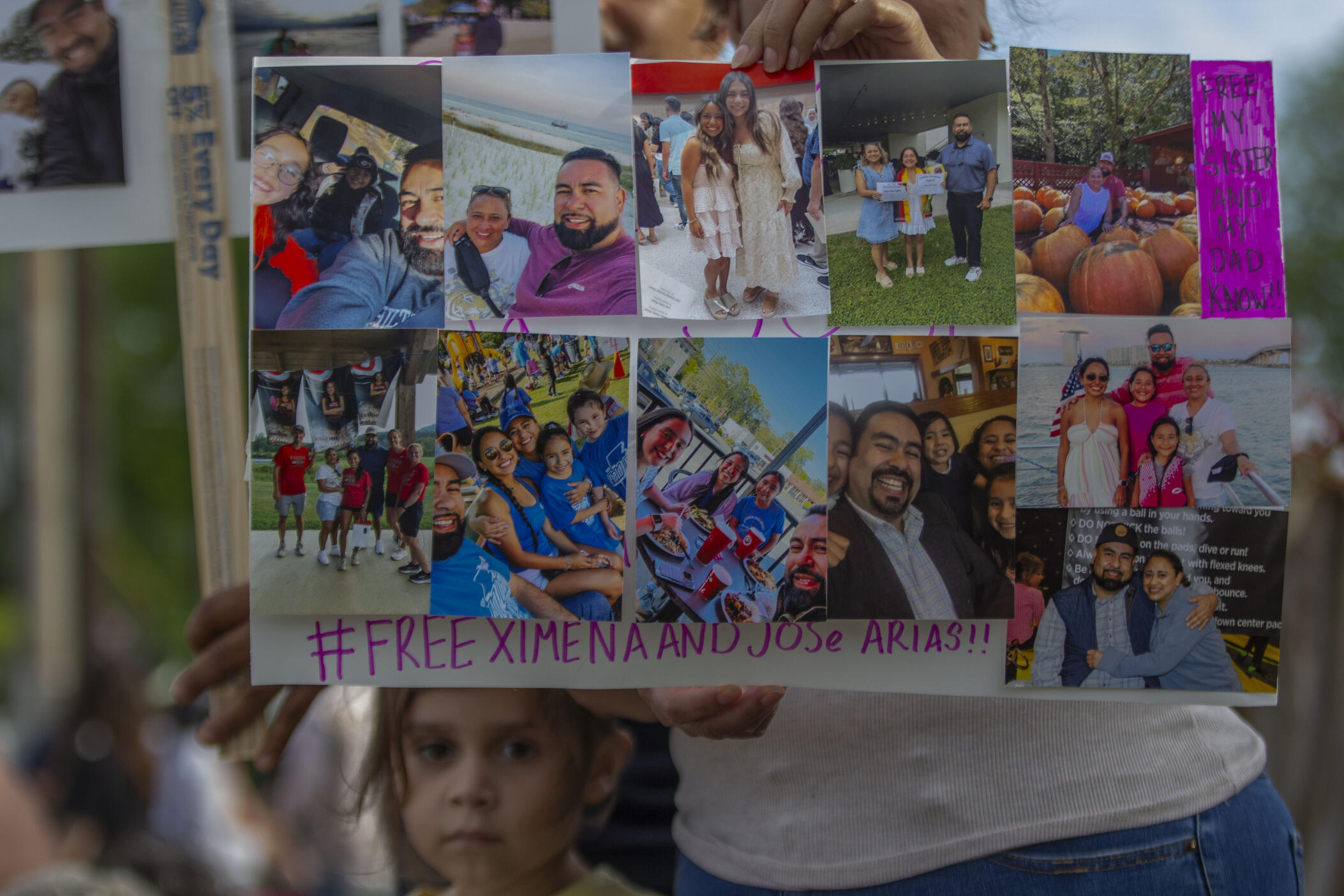A friend of Ximena Arias-Cristobal's family holds up a sign plastered with several photos of the 19-year-old, during a protest against the detainment of her and her father, Jose Arias-Tovar, in Dalton on May 14, 2025. Arias-Cristobal was arrested by local police during a traffic stop and sent to an ICE detention center in South Georgia shortly after, because she does not have valid U.S. citizenship.