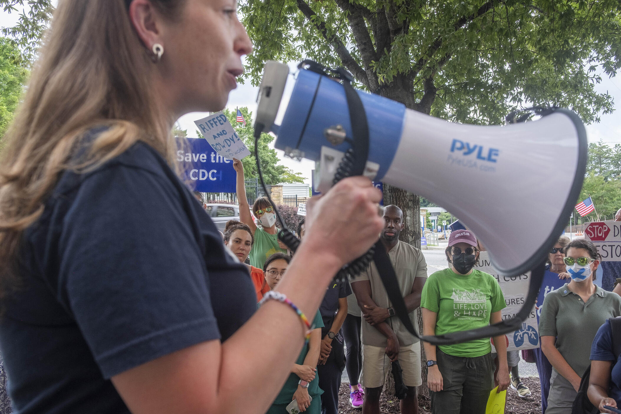 A mix of former and current CDC employees rallied across the street from the CDC main campus Tuesday to call for the resignation of Secretary of Health and Human Services Robert F. Kennedy, Jr. on the afternoon following Kennedy's disbanding on the CDC advisory panel on immunizations. 