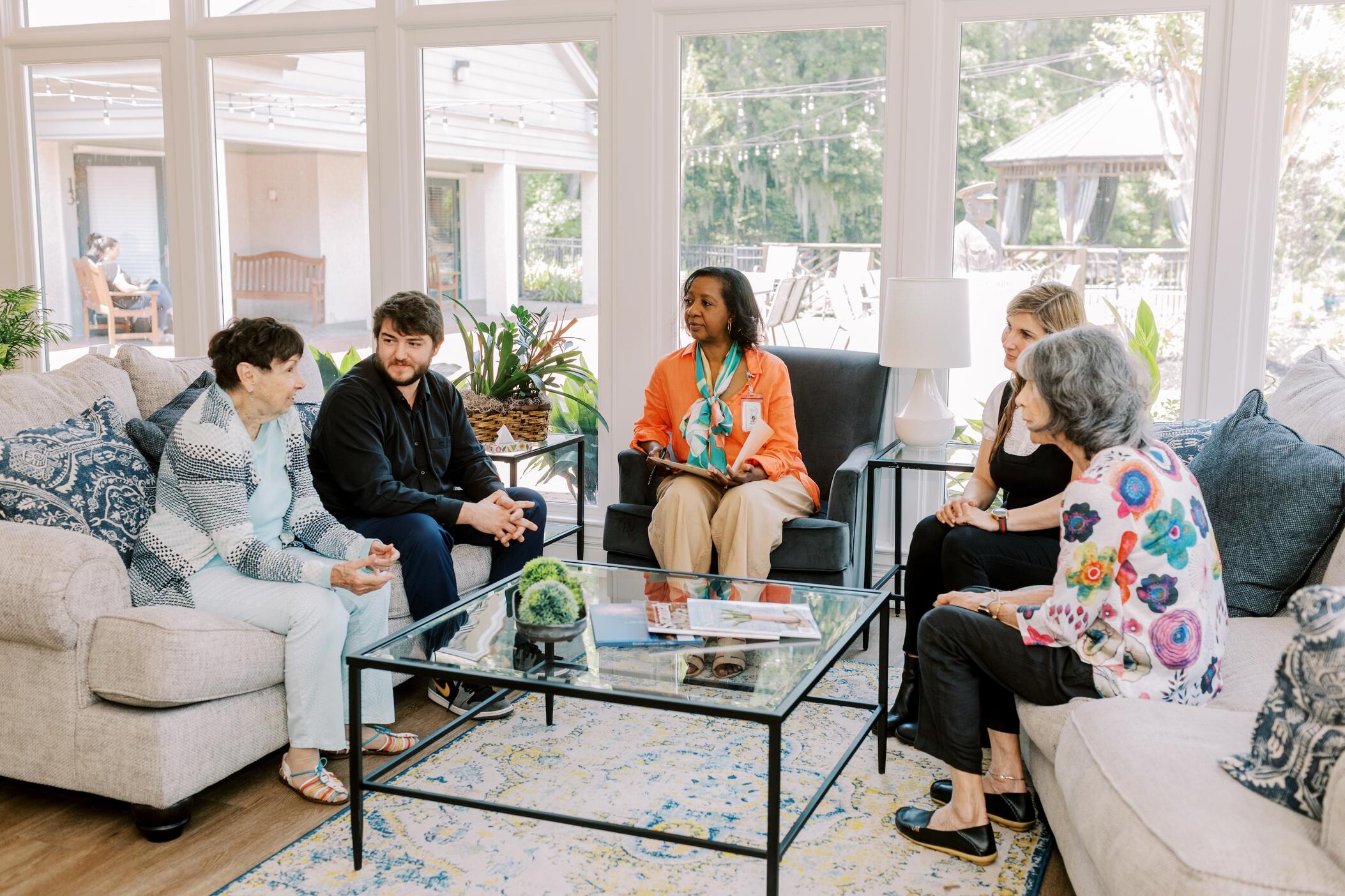 People sitting on couches talking