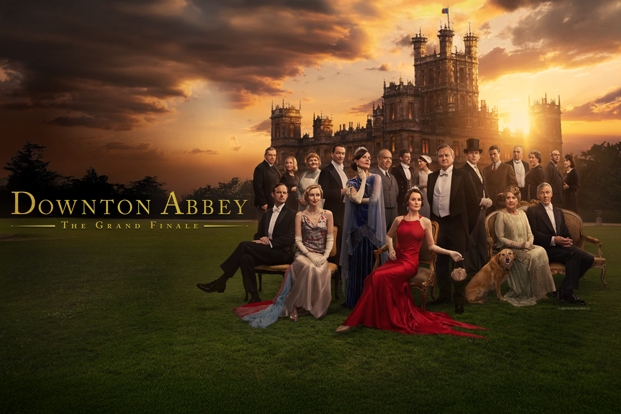 A group of Downton Abbey cast members pose in front of Highclere Castle