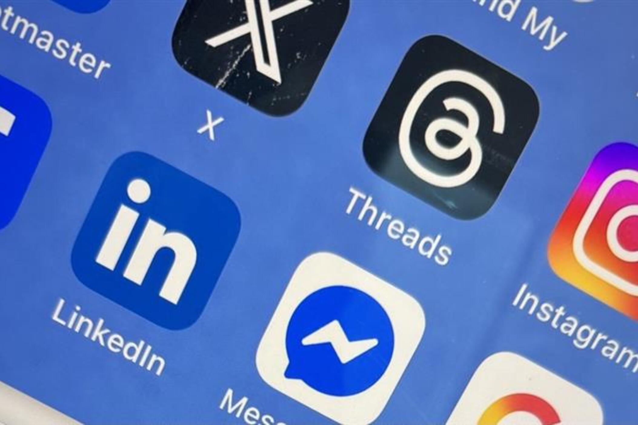 A closeup of a mobile device screen showing various social media apps
