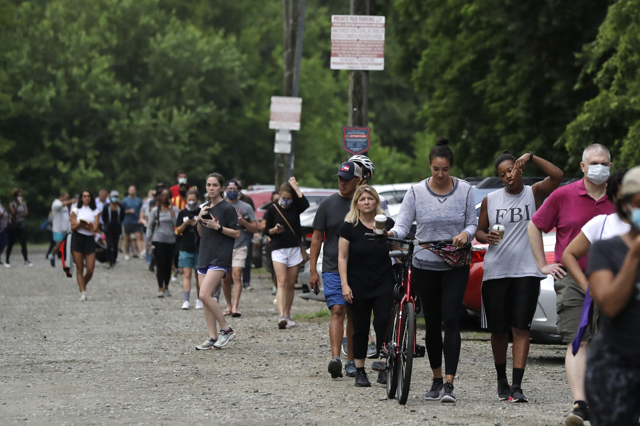 People wait in line to vote in Georgia's June 9, 2020, primary election at Park Tavern in Atlanta.