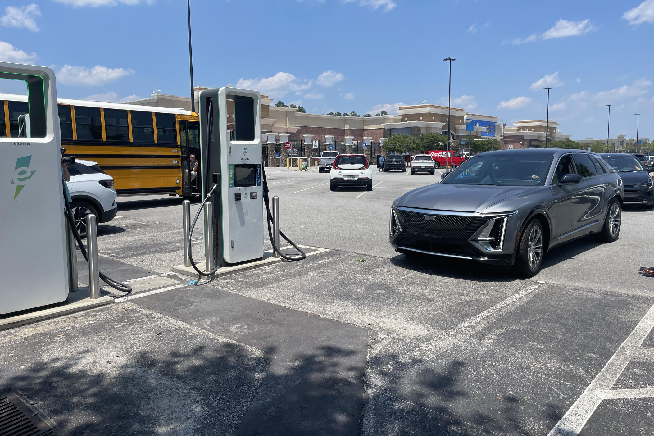 This charging station in Grovetown, Ga., was overcrowded. An electric school bus that was driving on a statewide clean-energy road show needed one charger; another charger was broken.