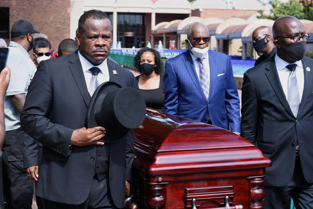 The final stop of the day, pallbearers led C.T. Vivian's casket near the tomb of Martin Luther King, Jr.