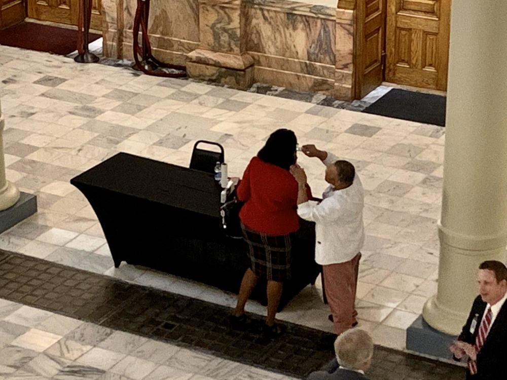 Georgia House members had their temperatures checked before entering into a special session called to ratify the governor's public health emergency.