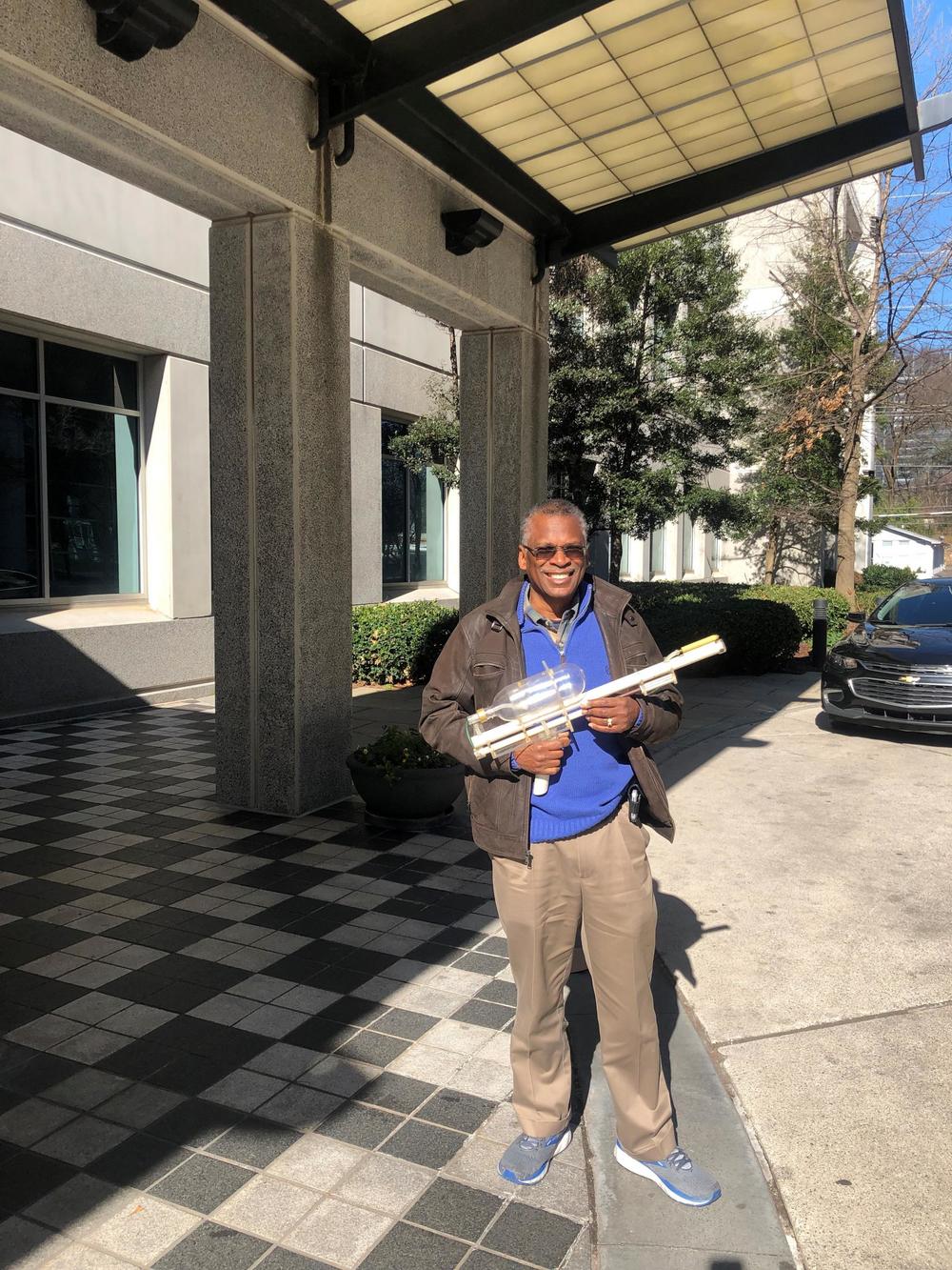 Dr. Lonnie Johnson pictured with his prototype for the Super Soaker.