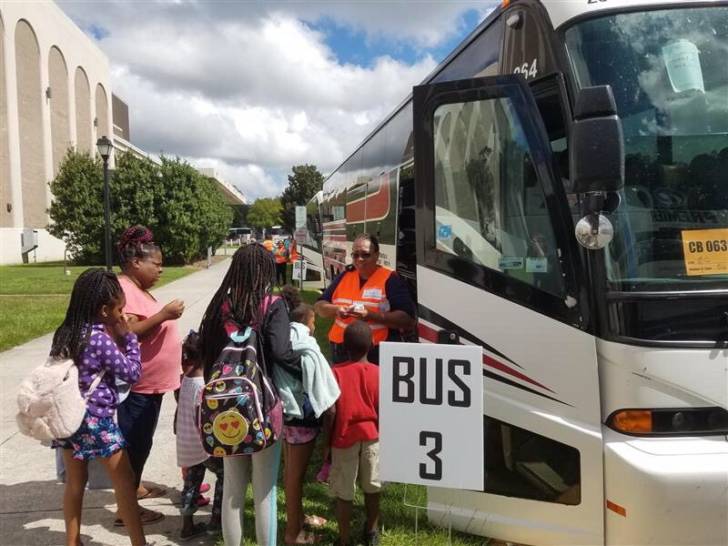 Evacuees board buses outside the Savannah Civic Center heading to Augusta ahead of Hurricane Dorian.