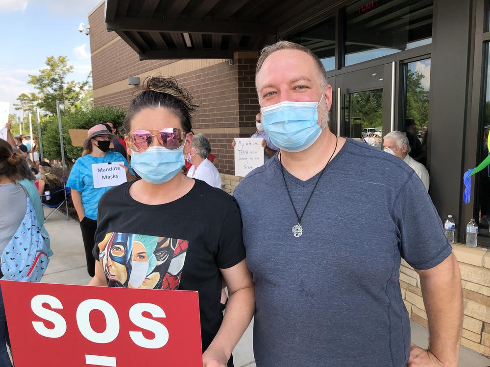 Nikki Crites (left) and Jamie Chambers demonstrate on behalf of Cherokee County educators Thursday July 16, 2020, in Canton.