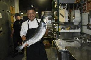 Chef Tano Phommasith of Carrollton’s Little Hawaiian prepares a fresh fish for his hungry customers. 