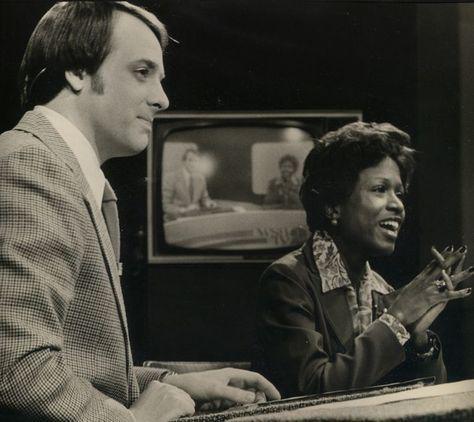 John Pruitt (left) and Monica Pearson (right) anchor an evening broadcast on WSB-TV.