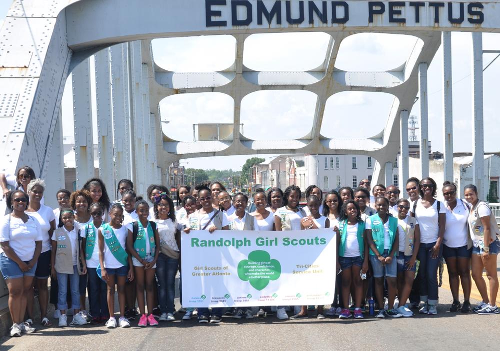 Nina Giddens is pictured with members of Atlanta's Randolph Girl Scout troops during a march over the Edmund Pettus Bridge in Selma, Alabama in 2015.