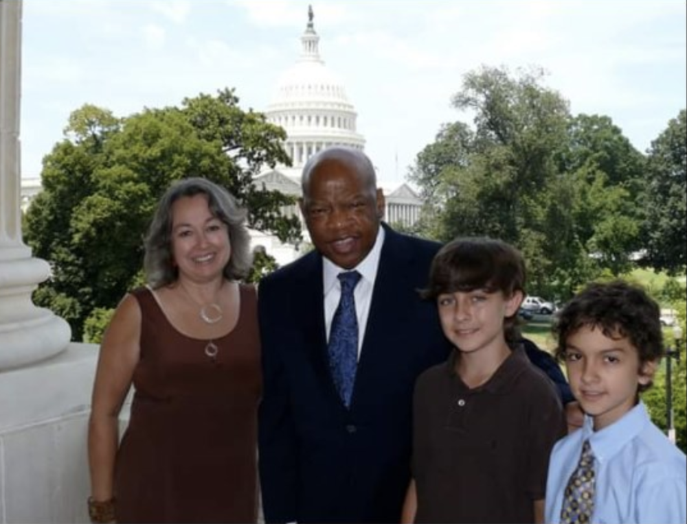 Royce Mann and his family with Rep. John Lewis at his Washington office in 2011.