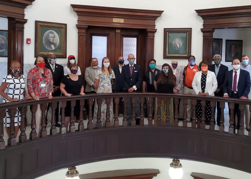 Members of Savannah's new race equity task force assemble in the city hall rotunda.