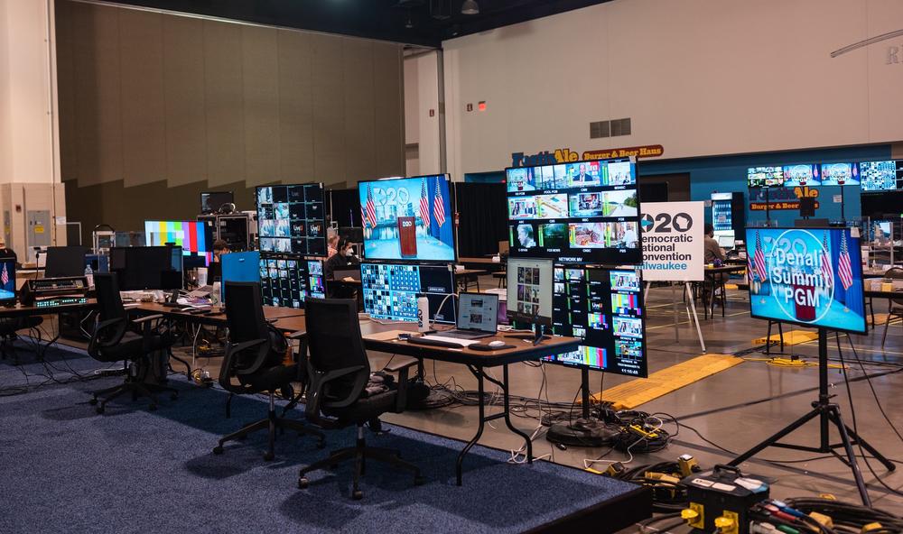 Computer and television screens crowd a large indoor space as producers prepare for the Democratic National Convention.