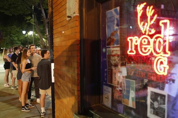 People wait to enter bar in Athens, Georgia.