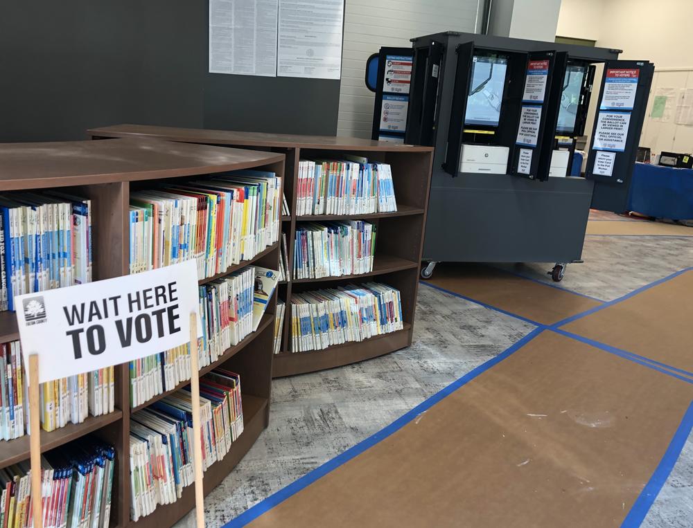 Signs and a voting machine in an Atlanta polling location.