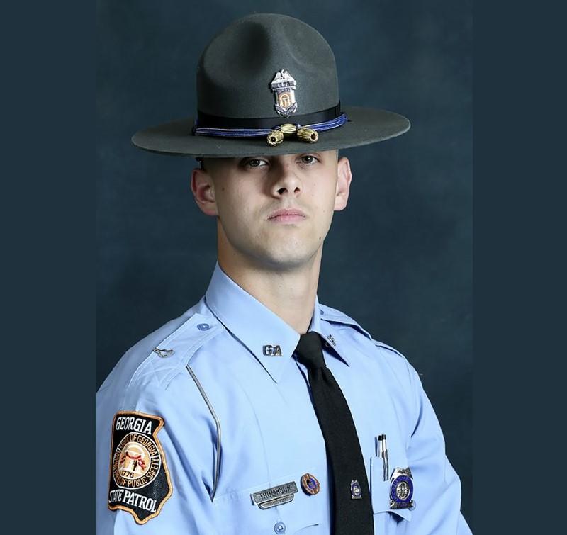 In this undated photo released by the Georgia Department of Public Safety, State trooper Jacob Gordon Thompson is seen in an official portrait. The Georgia Bureau of Investigation said in a statement Friday, Aug. 14, 2020 that Thompson was charged with felony murder and aggravated assault. The trooper has been fired and charged with murder a week after he fatally shot a 60-year-old man who attempted to flee a traffic stop.