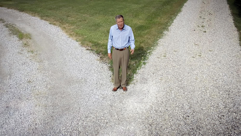John Kasich spoke at the Democratic Convention in a video where he stood at a fork in the road.