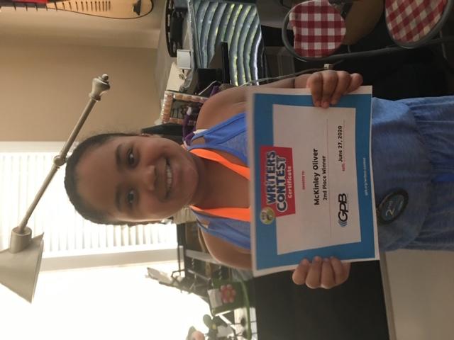 McKinley Oliver with award