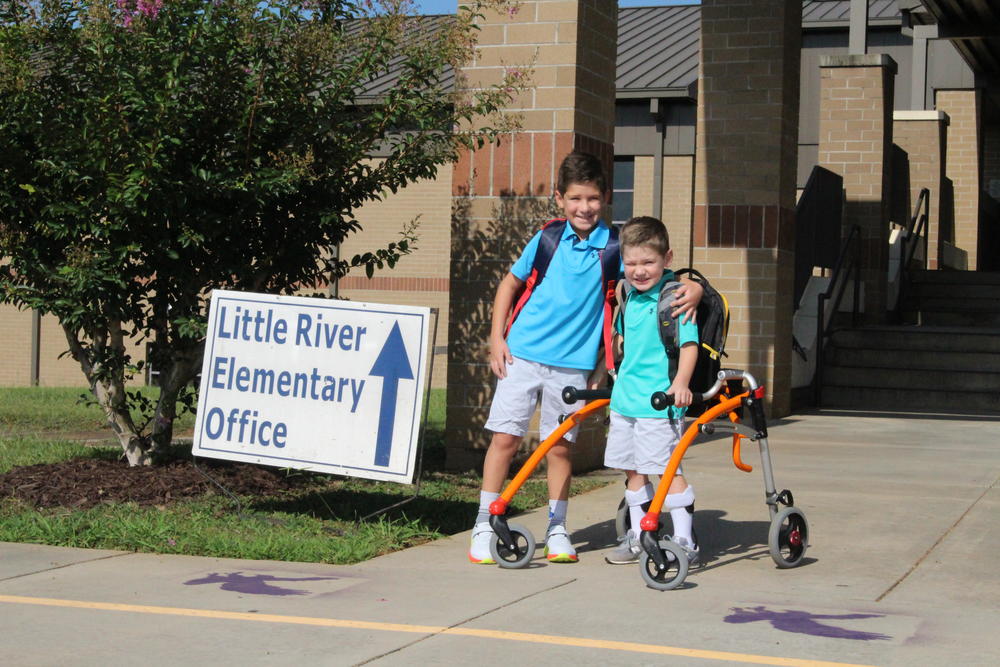 Parker and Camden Hanson outside Little River Elementary School in Woodstock, Georgia, where classes start Aug. 3, 2020.