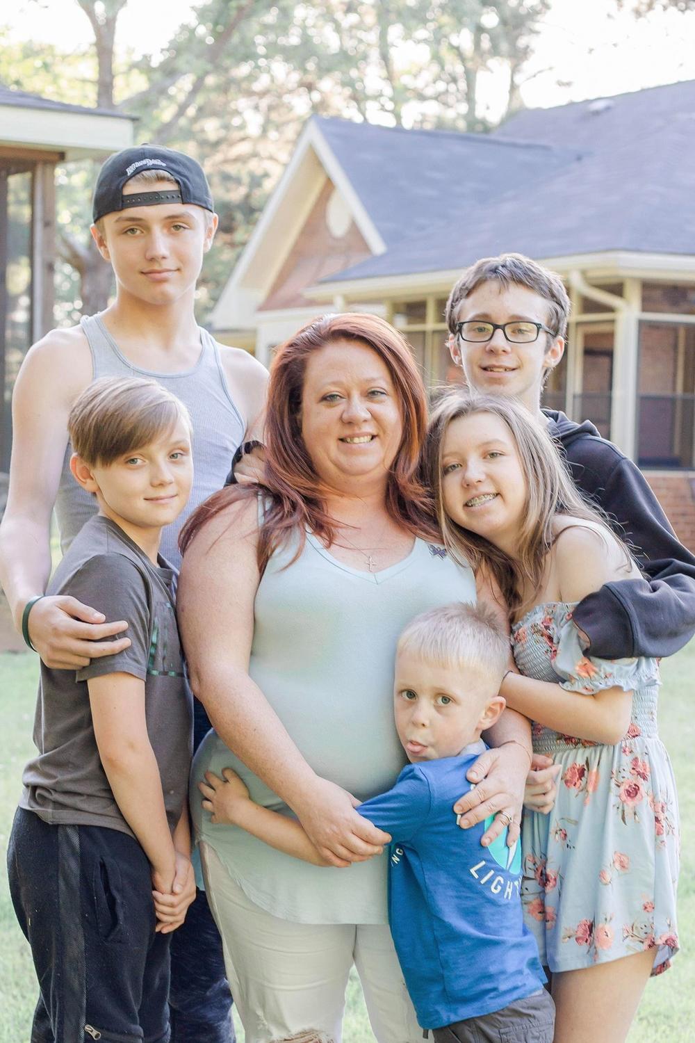 Stephanie Osterhout (center) with her children: (left to right) Sammy, 12, Jeremy, 14, Jay, 15, Alexis, 13, and Grayson, 5.