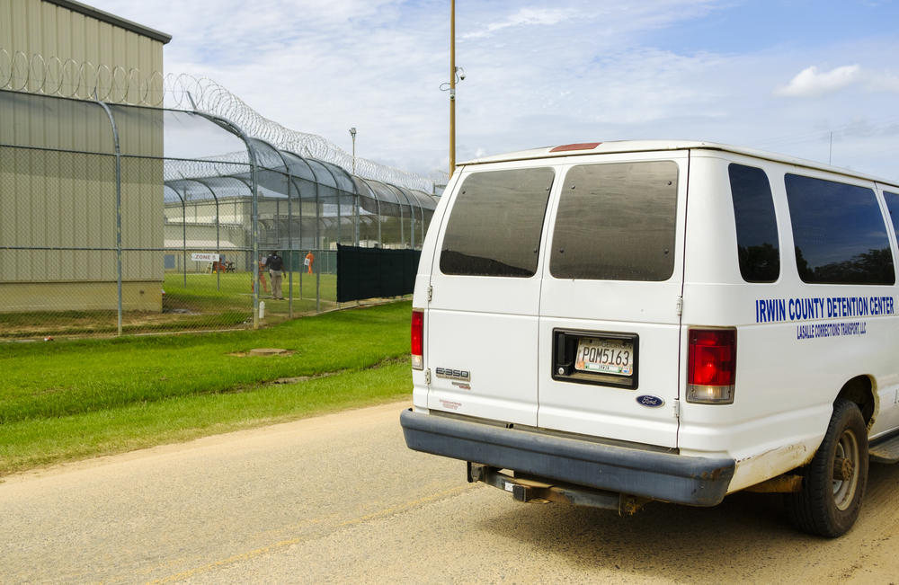 A van drives by inmates at the Irwin Center Detention Center Wednesday Sept. 25, 2020.